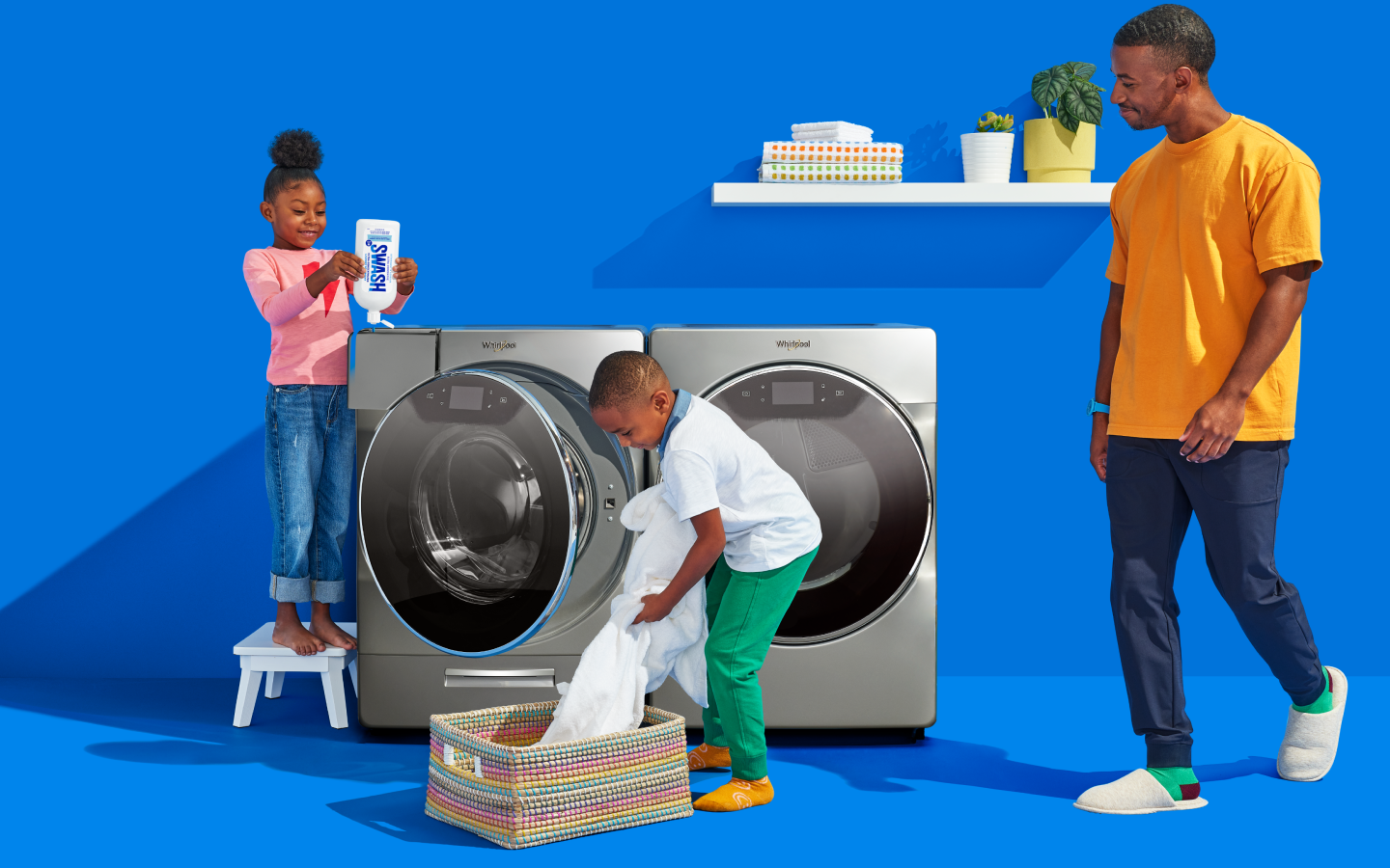 Family in laundry room doing laundry Family in laundry room doing laundry