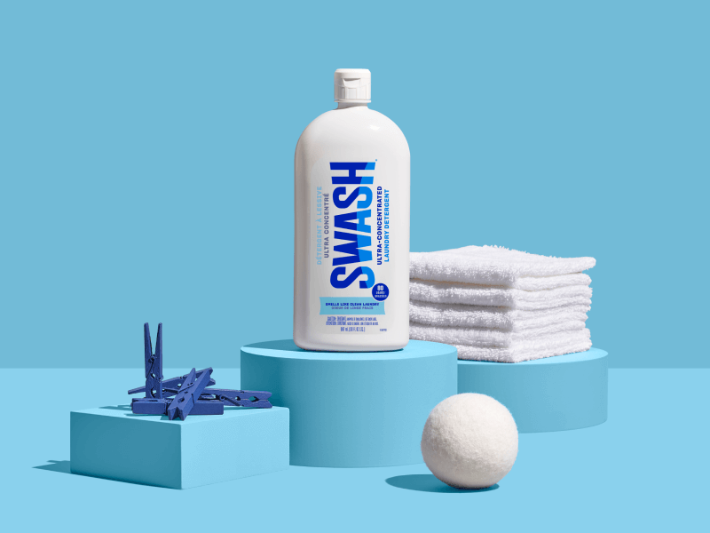 Swash® Laundry Detergent Smells Like Clean Laundry on pedestal with scent cues Swash® Laundry Detergent Smells Like Clean Laundry on pedestal with scent cues