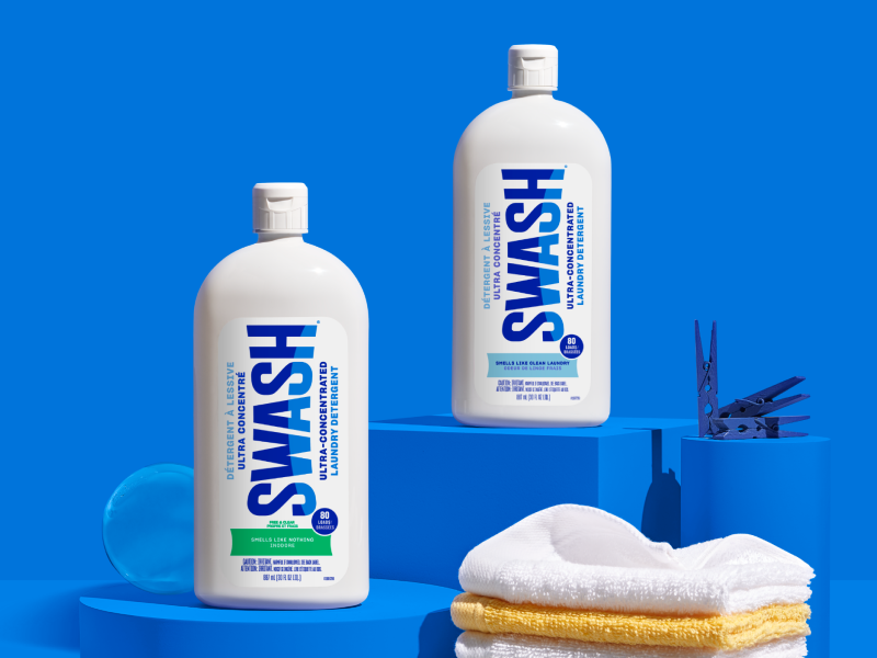 Two different bottles of Swash arranged on a counter.
